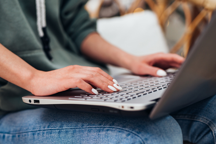 Person typing on a laptop