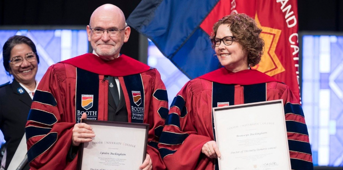 A picture of General and Commissioner Buckingham in robes holding honourary degrees.